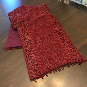 Beautiful red table runner with beaded detail on ends.